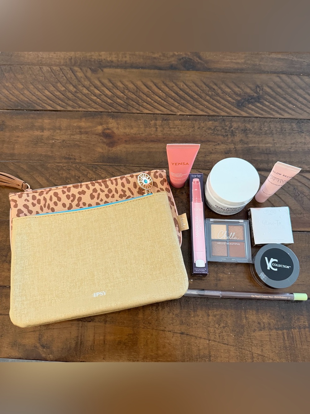 ipsy beige  Canvas Cosmetic Pouch and Leopard pouch with assorted cosmetics